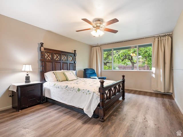 450 W Chokecherry Cir, Orem, UT 84058 - bedroom with wood finished floors, baseboards, and ceiling fan