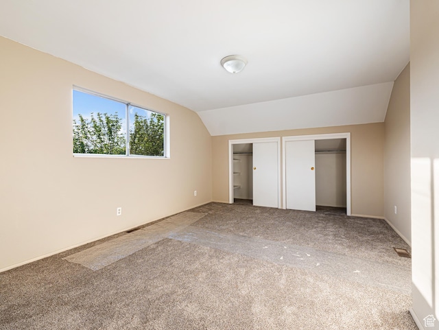 450 W Chokecherry Cir, Orem, UT 84058 - unfurnished bedroom featuring multiple closets, lofted ceiling, and carpet floors