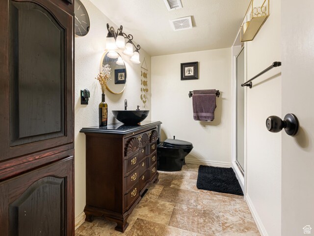 450 W Chokecherry Cir, Orem, UT 84058 - full bath with baseboards, stone finish flooring, vanity, a shower stall, and toilet