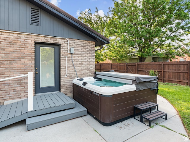 450 W Chokecherry Cir, Orem, UT 84058 - view of patio / terrace with a hot tub and fence