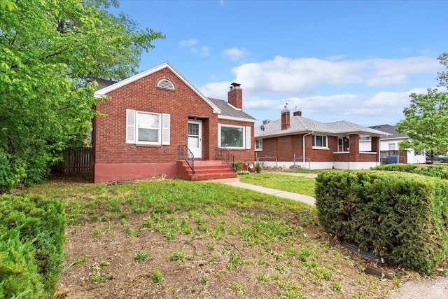 3214 Porter Ave, Ogden, UT 84403 - bungalow-style home featuring brick siding and a chimney