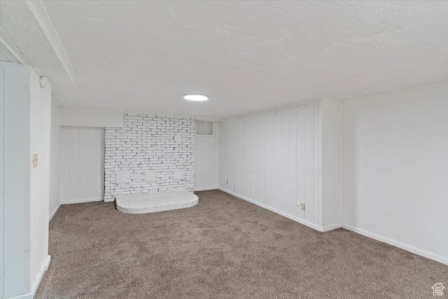 3214 Porter Ave, Ogden, UT 84403 - finished below grade area featuring a textured ceiling, carpet flooring, and baseboards