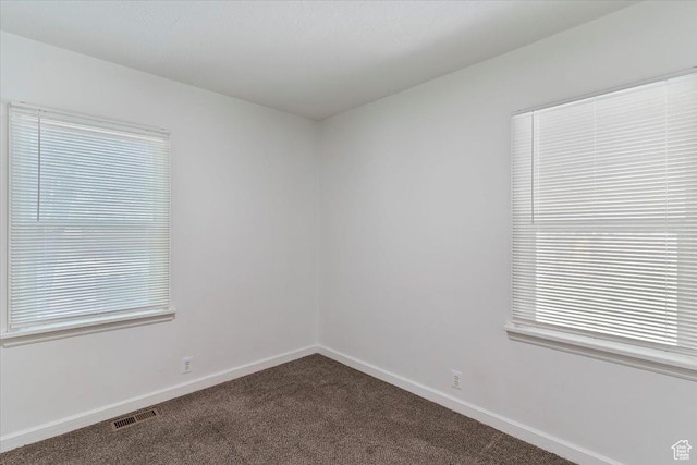 3214 Porter Ave, Ogden, UT 84403 - spare room featuring dark carpet and baseboards