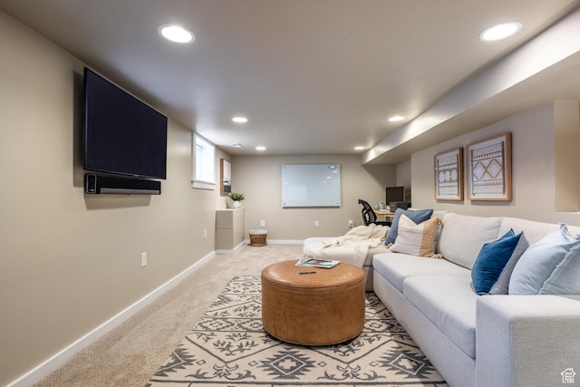living area featuring light carpet, recessed lighting, and baseboards