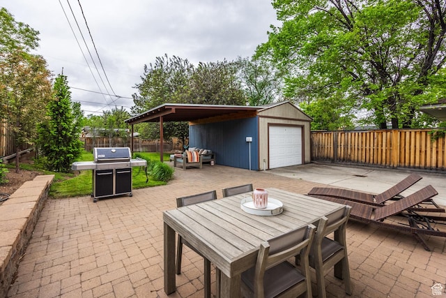 view of patio / terrace featuring a fenced backyard, an outbuilding, and area for grilling