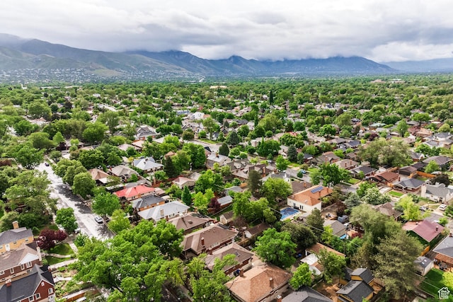 aerial view of residential area featuring mountains