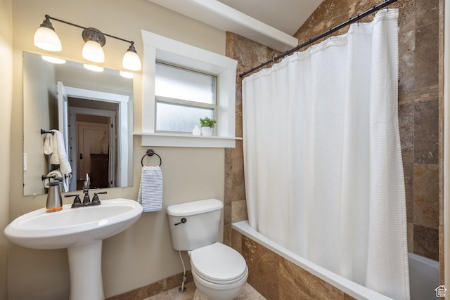 full bath featuring tiled shower / bath and toilet