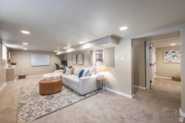 carpeted living room featuring recessed lighting and baseboards