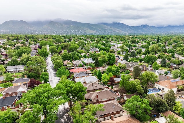 aerial view of residential area featuring a mountain backdrop
