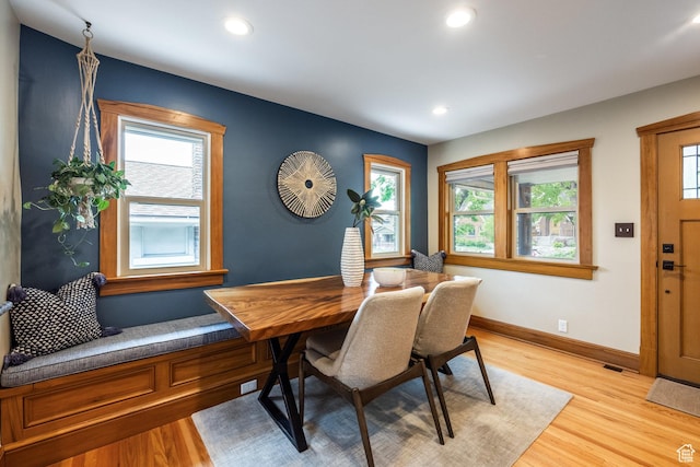 dining room with plenty of natural light, light wood finished floors, recessed lighting, and baseboards