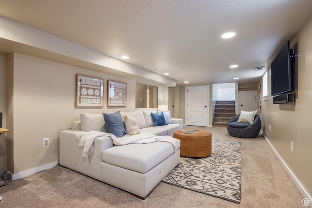 carpeted living room with recessed lighting, stairs, and baseboards