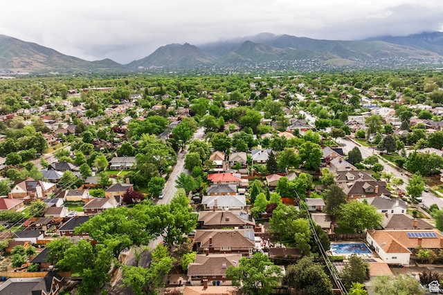 aerial view of residential area featuring mountains