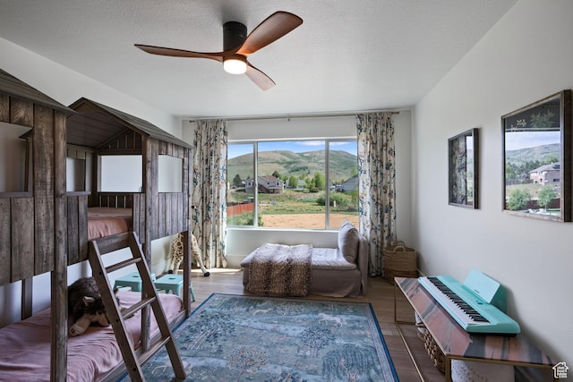 3232 E 5225 N, Eden, UT 84310 - bedroom with wood finished floors, a ceiling fan, and a mountain view