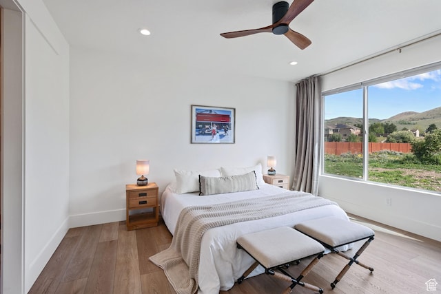 3232 E 5225 N, Eden, UT 84310 - bedroom featuring baseboards, light wood-style flooring, recessed lighting, a mountain view, and a ceiling fan