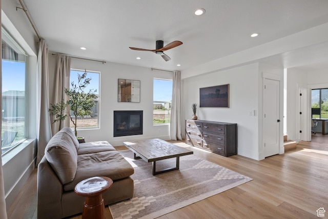 3232 E 5225 N, Eden, UT 84310 - living area featuring a ceiling fan, light wood-style flooring, a glass covered fireplace, baseboards, and recessed lighting