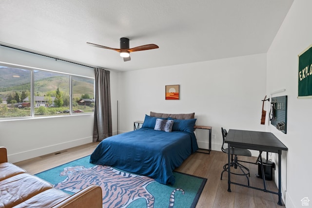 3232 E 5225 N, Eden, UT 84310 - bedroom with wood finished floors, baseboards, and a ceiling fan