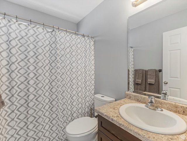 full bath featuring toilet and vanity
