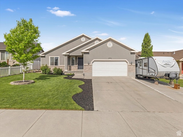 view of front of property with concrete driveway, an attached garage, and stucco siding