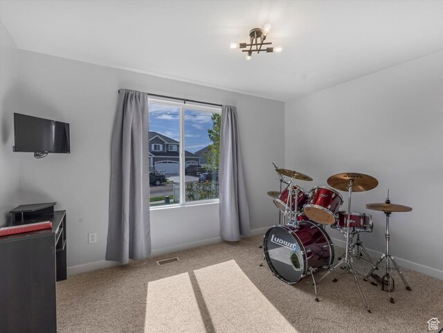 playroom featuring carpet floors and baseboards