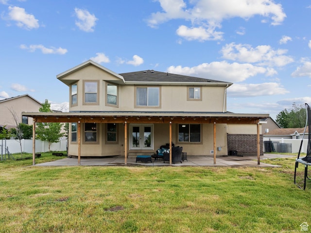 1370 S 1500 W, Springville, UT 84663 - back of property featuring a trampoline, a patio, french doors, and stucco siding