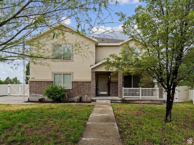 1370 S 1500 W, Springville, UT 84663 - view of front of property with a gate, stucco siding, covered porch, and brick siding