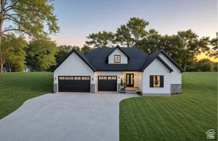 268 W 3400 S Unit 5, Nibley, UT 84321 - modern farmhouse featuring concrete driveway, a front lawn, and an attached garage