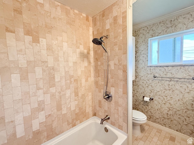 bathroom featuring toilet, bathtub / shower combination, baseboards, and ornamental molding