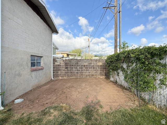fenced backyard featuring a patio