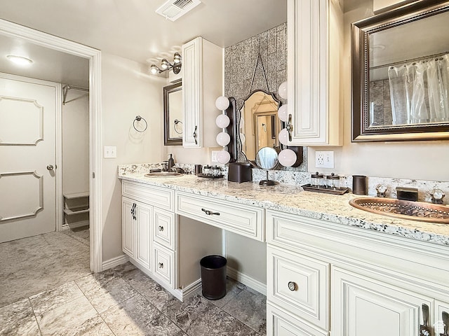 full bathroom with double vanity