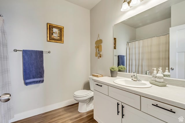 927 W Coral Charm Way Unit M202, Saratoga Springs, UT 84045 - bathroom featuring vanity, wood finished floors, toilet, and baseboards