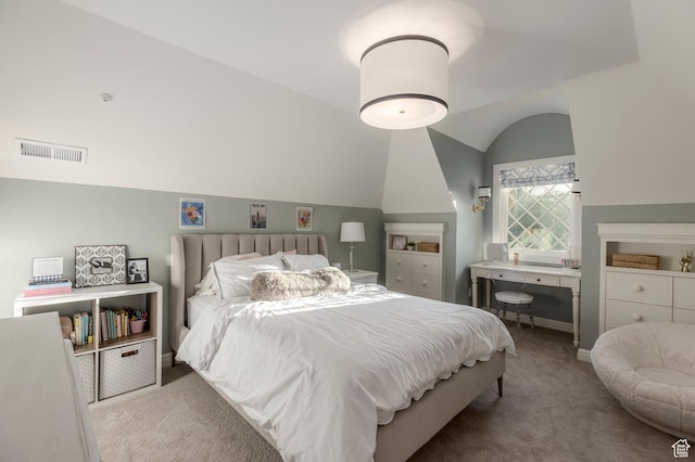 carpeted bedroom with vaulted ceiling