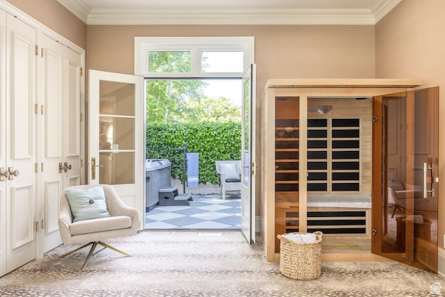 doorway with crown molding and a sauna