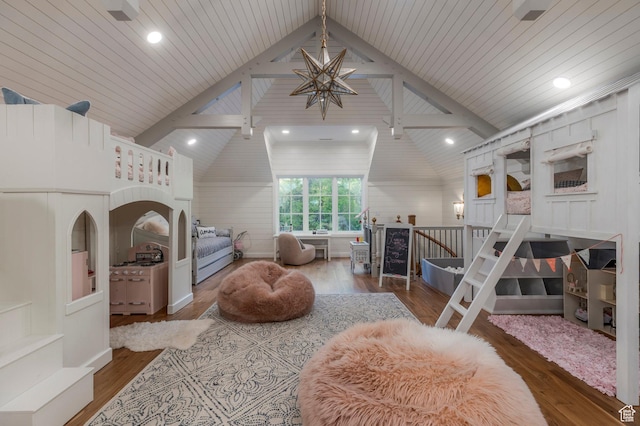 bedroom featuring lofted ceiling, wood finished floors, a chandelier, and recessed lighting