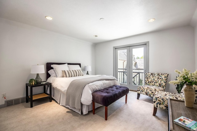 bedroom featuring access to exterior, light colored carpet, and recessed lighting