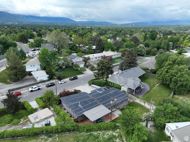 aerial view of residential area featuring a mountainous background