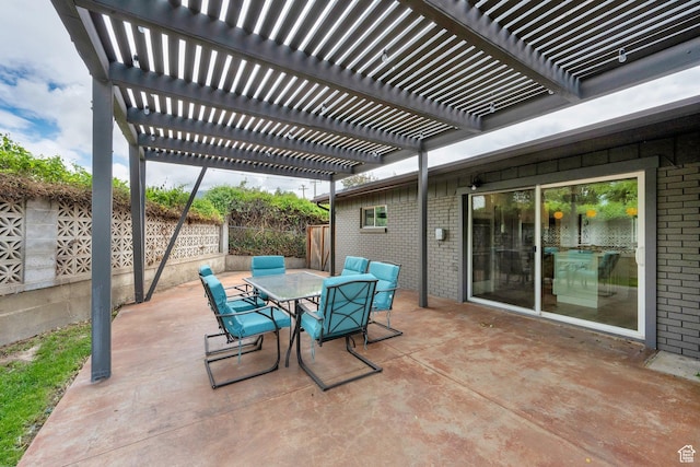 view of patio with fence, outdoor dining area, and a pergola