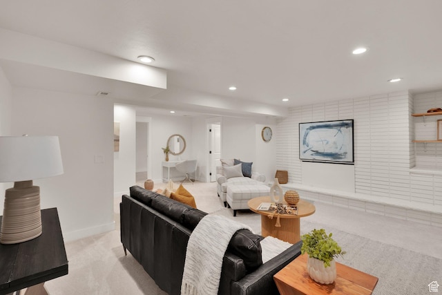 living area with light colored carpet, recessed lighting, and baseboards