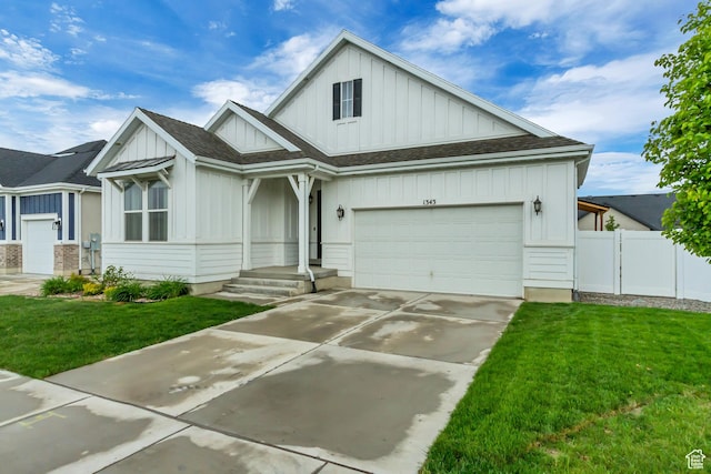 1343 N 3350 W, Provo, UT 84601 - view of front facade featuring board and batten siding, concrete driveway, a garage, and a shingled roof