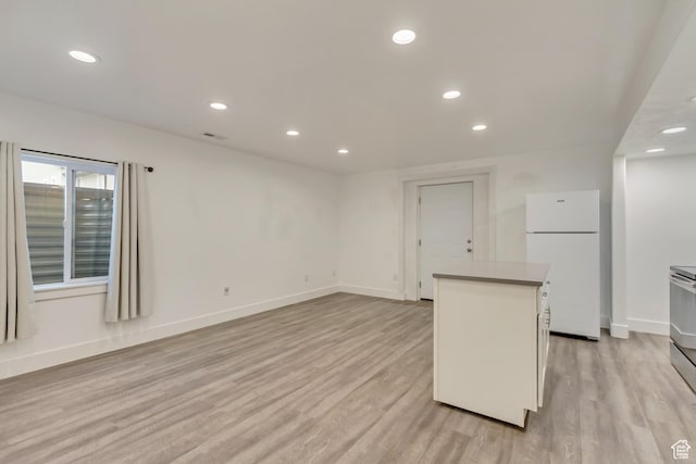1343 N 3350 W, Provo, UT 84601 - kitchen featuring freestanding refrigerator, a center island, light wood finished floors, recessed lighting, and baseboards