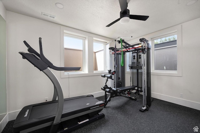 1565 N Overolook Ct, Farmington, UT 84025 - exercise area with baseboards, ceiling fan, and a textured ceiling