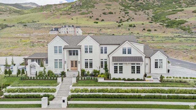 1565 N Overolook Ct, Farmington, UT 84025 - view of front of property with a standing seam roof, a mountain view, and metal roof