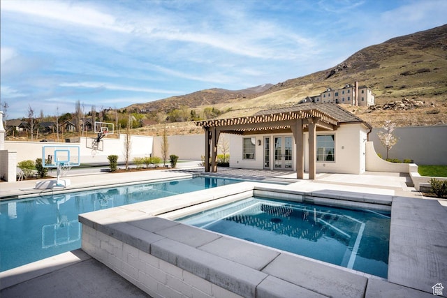 1565 N Overolook Ct, Farmington, UT 84025 - swimming pool featuring a mountain view, an in-ground hot tub, french doors, and fence