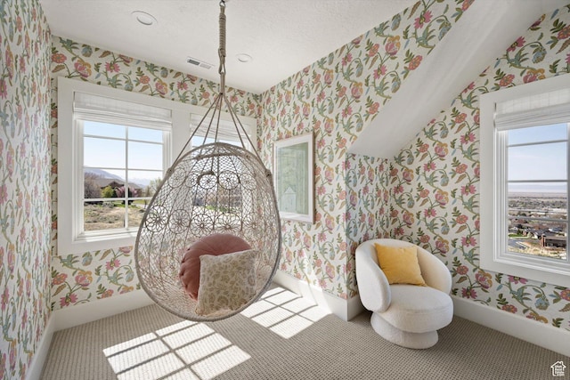 1565 N Overolook Ct, Farmington, UT 84025 - living area with wallpapered walls, plenty of natural light, baseboards, and a textured ceiling