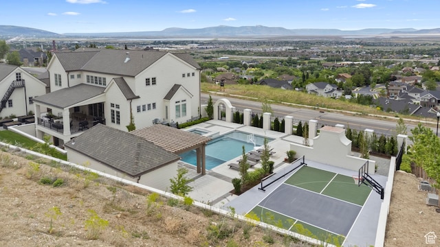 1565 N Overolook Ct, Farmington, UT 84025 - aerial view of residential area featuring a mountainous background and a pool area