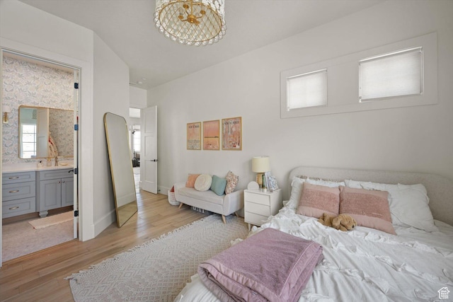 1565 N Overolook Ct, Farmington, UT 84025 - bedroom featuring light wood finished floors, ensuite bathroom, and baseboards
