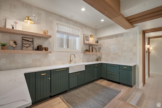 1565 N Overolook Ct, Farmington, UT 84025 - kitchen featuring green cabinets, open shelves, a sink, backsplash, and light stone countertops