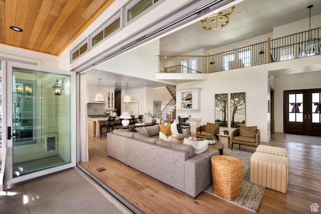 1565 N Overolook Ct, Farmington, UT 84025 - living room with stairs, wood finished floors, and a high ceiling