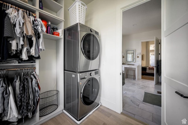 1565 N Overolook Ct, Farmington, UT 84025 - laundry room featuring stacked washer / drying machine and light wood-style flooring