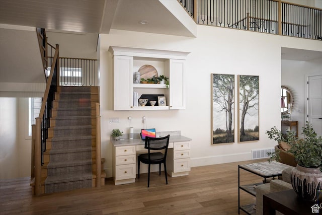 1565 N Overolook Ct, Farmington, UT 84025 - living room with light wood-style floors, stairway, and baseboards