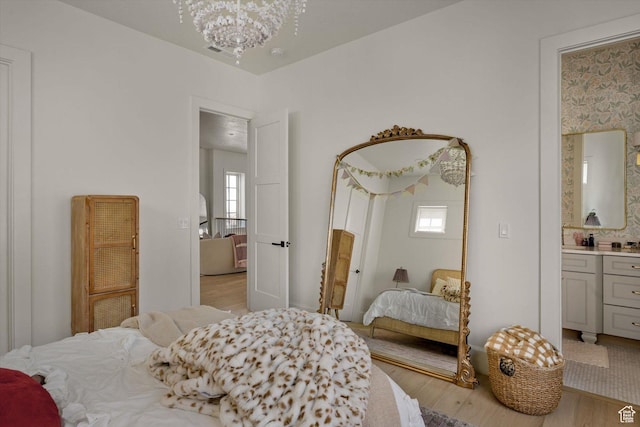 1565 N Overolook Ct, Farmington, UT 84025 - bedroom with light wood finished floors, multiple windows, and a chandelier